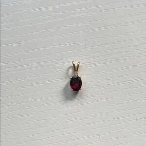 Gold Pendant with Red Gemstone
